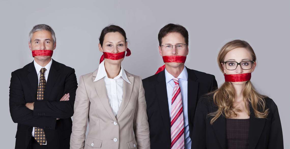 Workers with covered mouths.