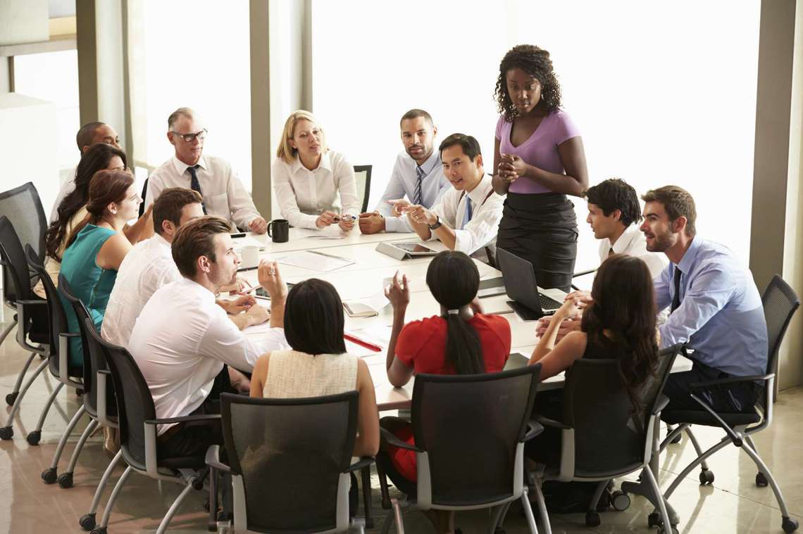 Group of co-workers around a table.