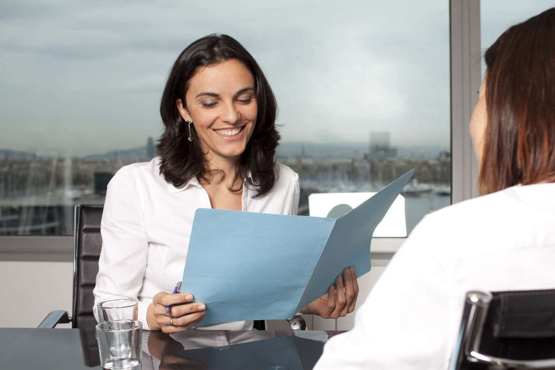 Woman recruiter reviews candidate documents
